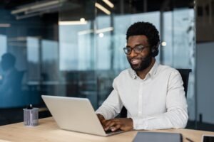 IT administrator comparing Faxination modular fax platform edition options on a laptop