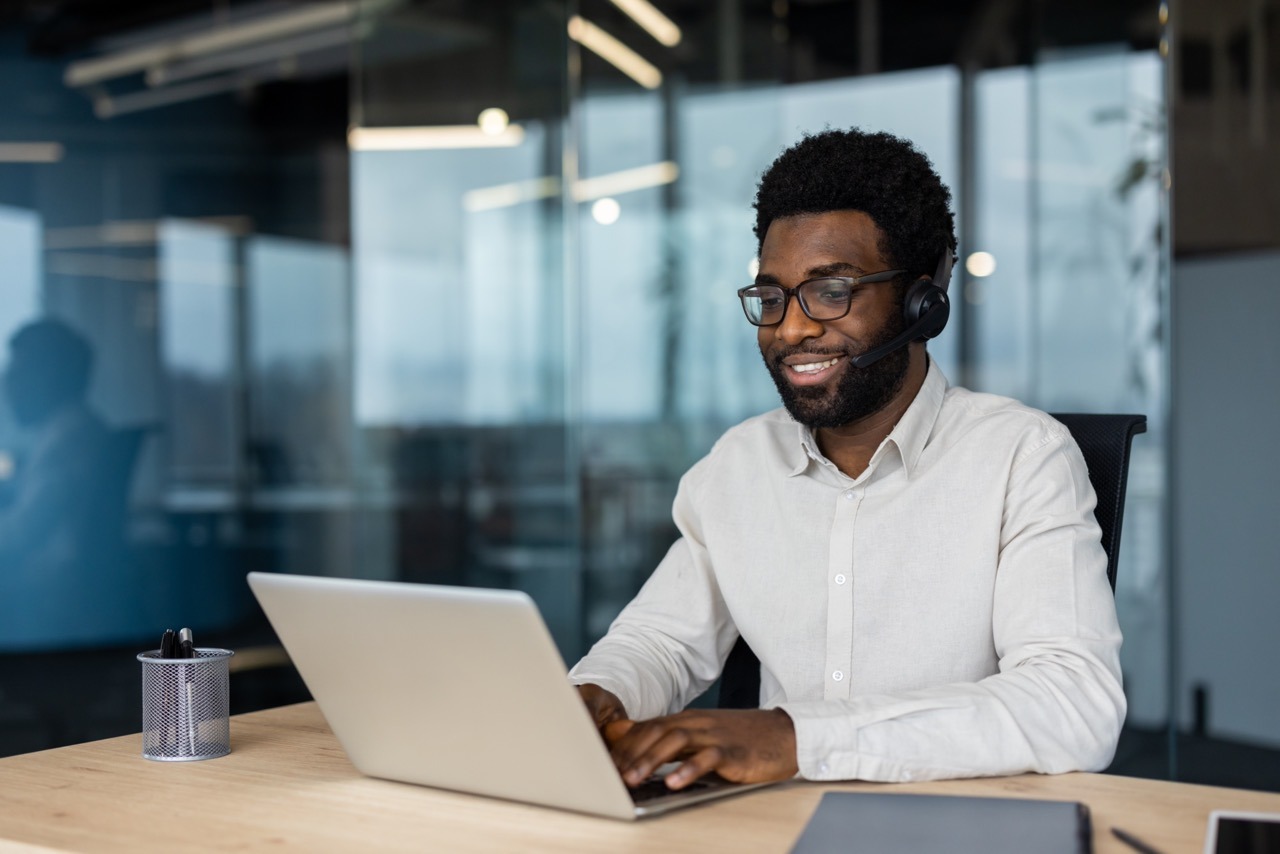 IT administrator comparing Faxination modular fax platform edition options on a laptop