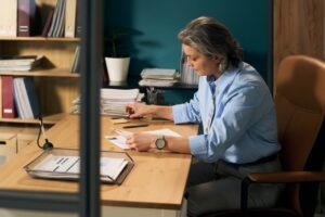 Government procurement officer reviewing vendor bid submission records, delivery confirmations, and audit trail logs in Faxination cloud fax platform for RFP compliance documentation