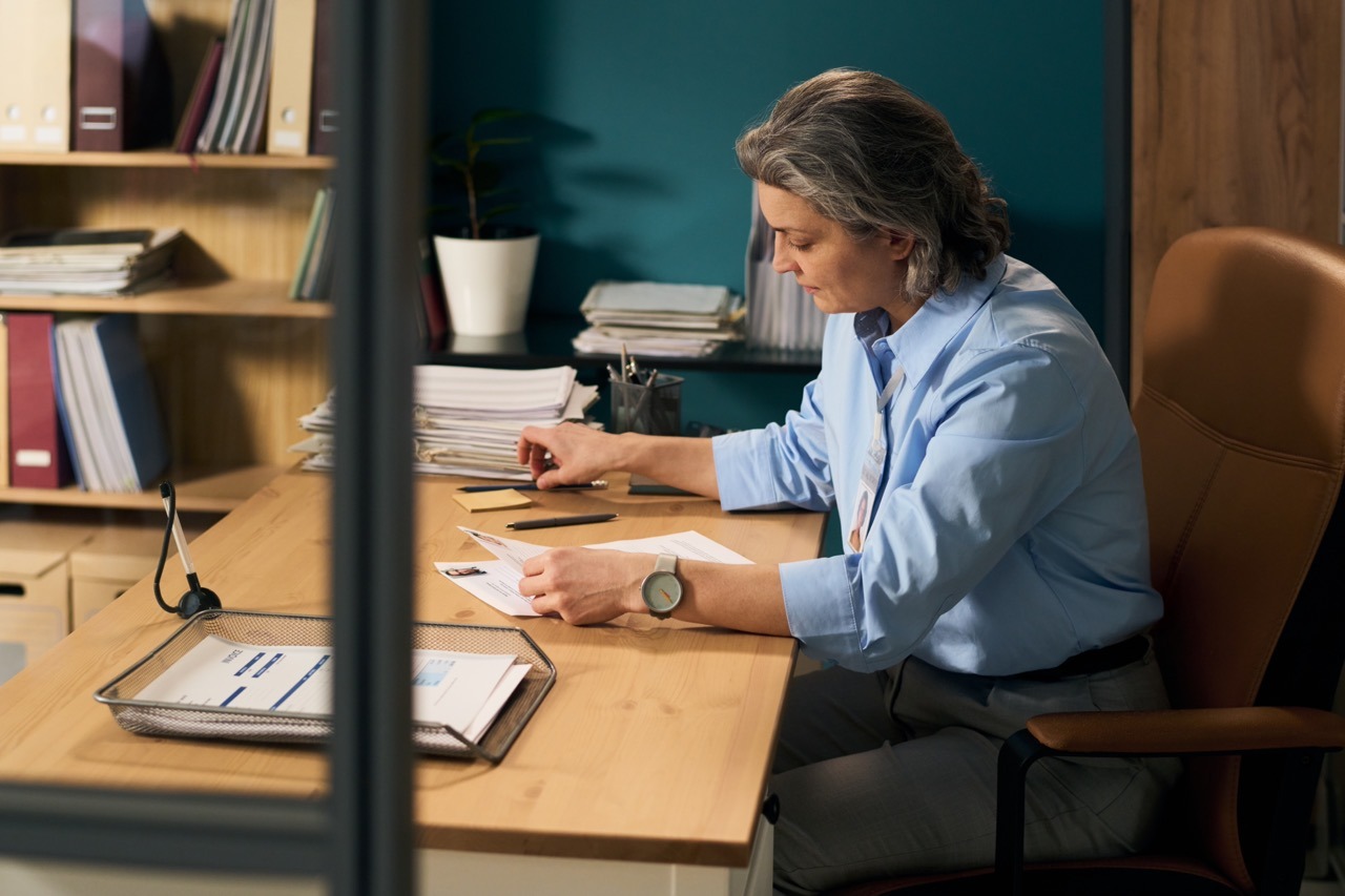 Government procurement officer reviewing vendor bid submission records, delivery confirmations, and audit trail logs in Faxination cloud fax platform for RFP compliance documentation