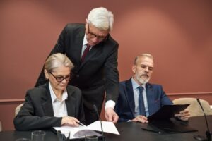 Government IT leader reviewing disaster recovery continuity of operations plan with cloud fax infrastructure redundancy and Faxination platform uptime dashboard