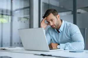IT director building a total cost of ownership comparison between on-premise fax server maintenance costs and Faxination managed cloud fax subscription pricing across three locations