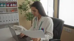 County health department epidemiologist reviewing communicable disease case reports received by secure cloud fax