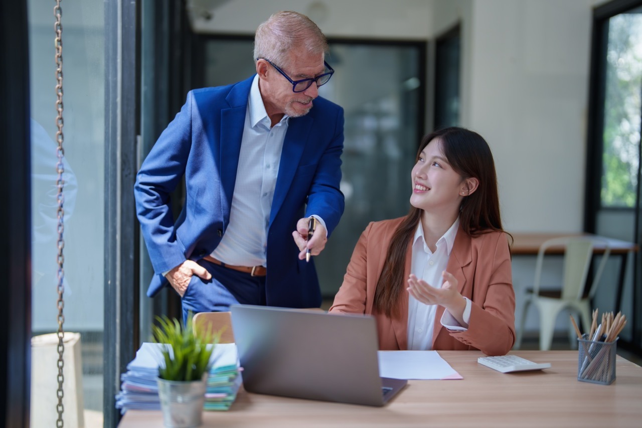 IT director reviewing centralized Faxination cloud fax administration portal showing user provisioning, audit logs, and compliance configuration unified across multiple office locations