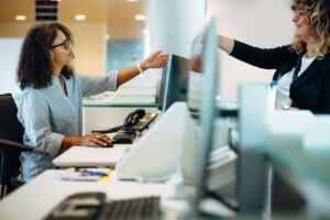 small business owner sending a fax to a supplier that has no digital system in place