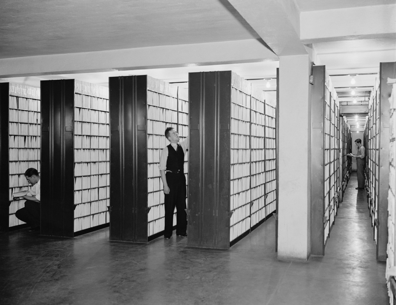 Government records officer reviewing fax transmission logs for a public records request