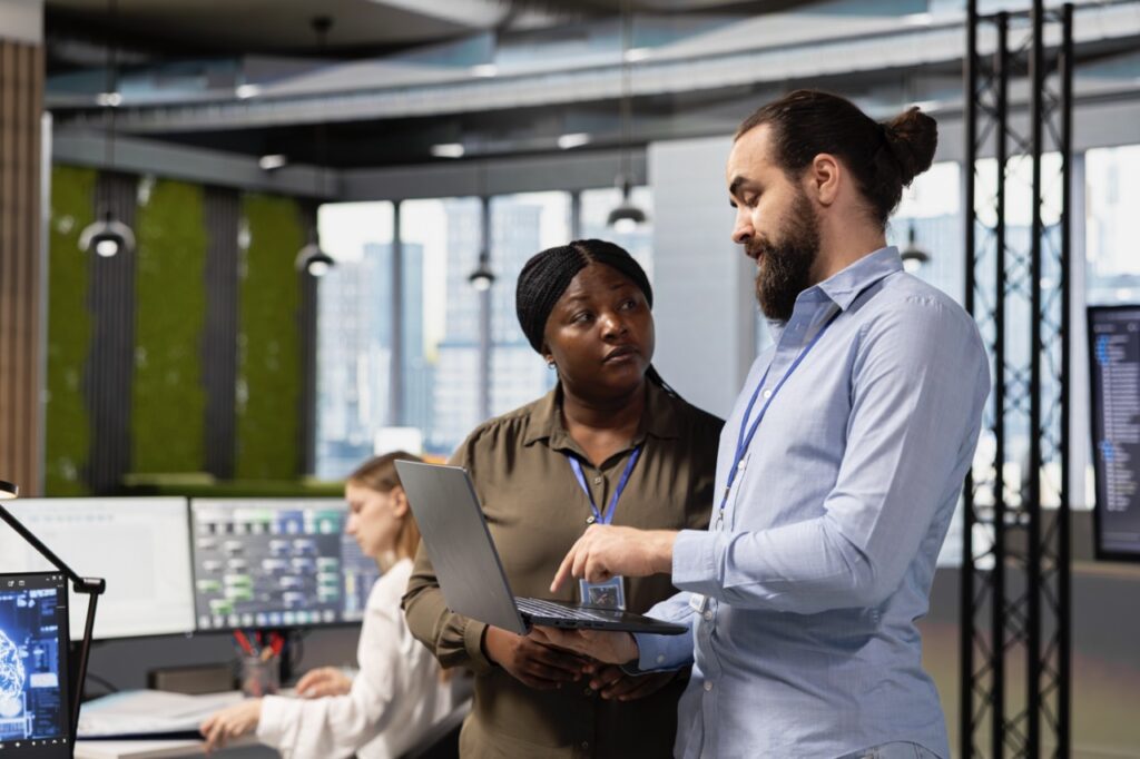 IT administrator monitoring cloud fax infrastructure integrated invisibly into daily business workflows