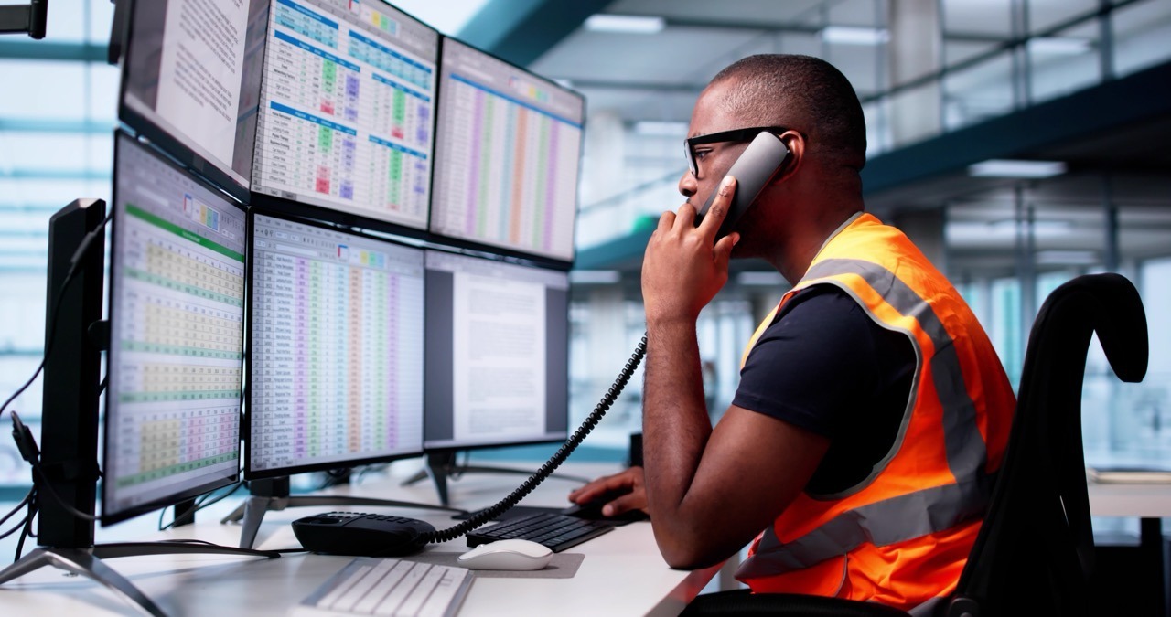 Emergency operations center staff transmitting a situation report by cloud fax
