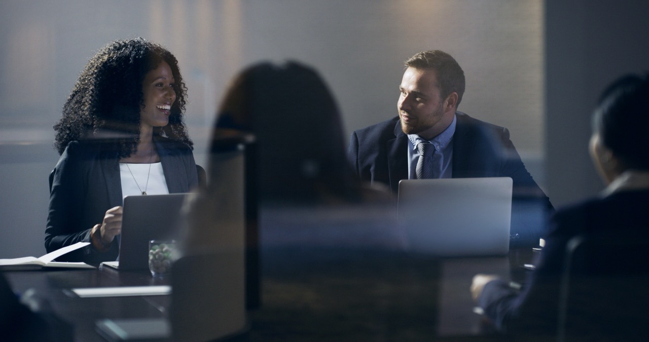 Global procurement team exchanging documents by fax across international borders
