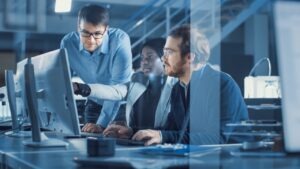 IT team reviewing an enterprise fax management dashboard and compliance reports