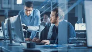 IT team reviewing an enterprise fax management dashboard and compliance reports