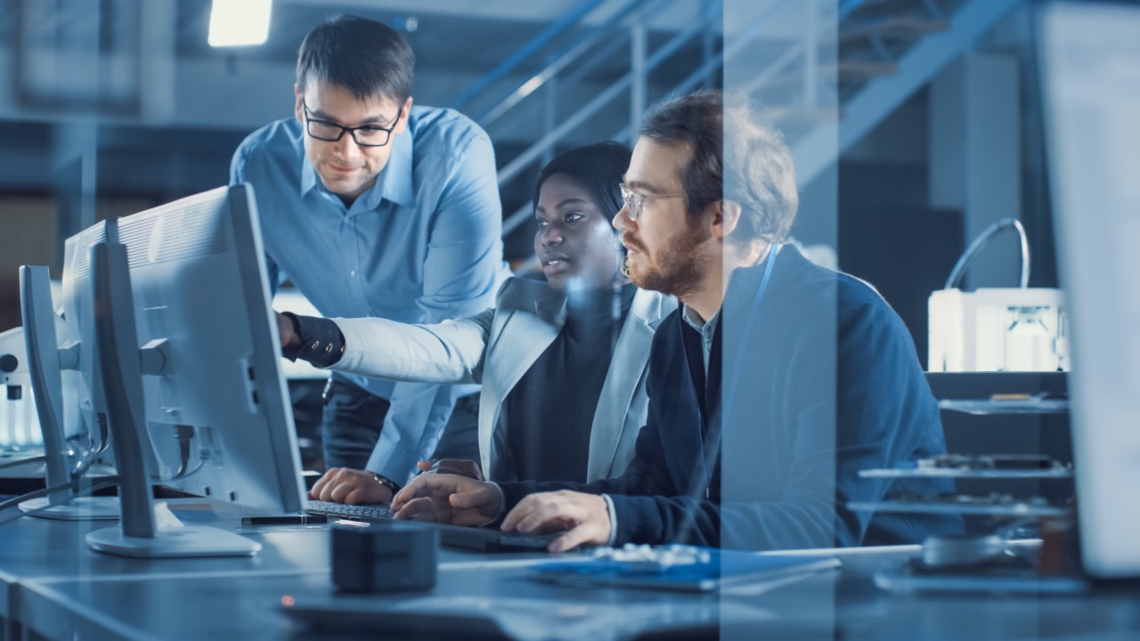IT team reviewing an enterprise fax management dashboard and compliance reports