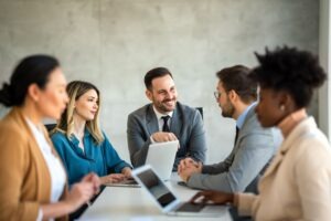 Business team meeting around a conference table to discuss enterprise fax investment strategy